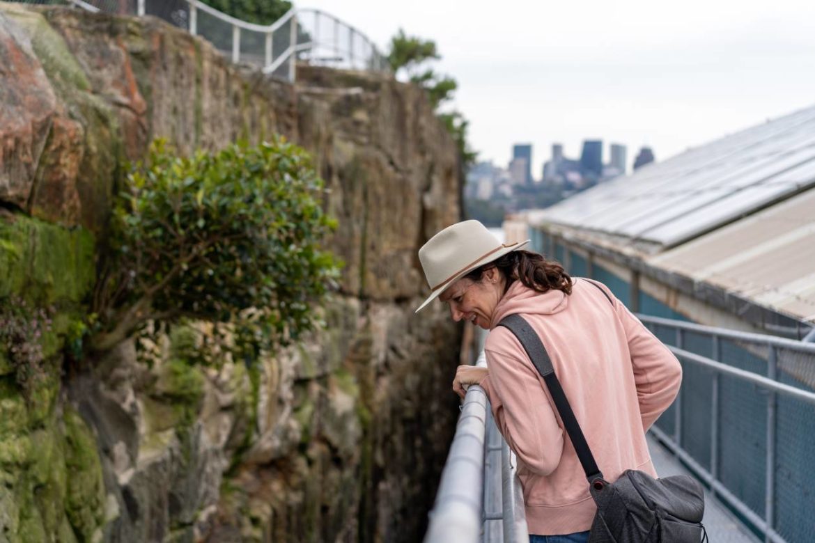 person-on-walkway-in-between-two-old-rusty-industr-2021-10-22-11-34-16-utc(1)